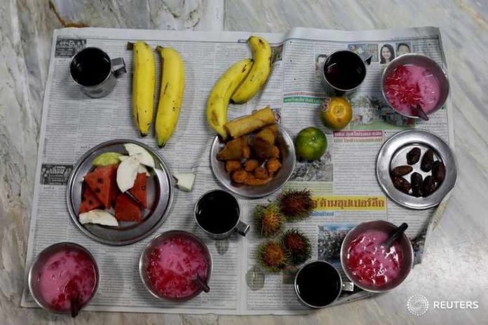 Food is seen before people break the fast on the first day of Ramadan in a Mosque in Bangkok