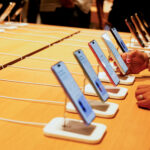 FILE PHOTO: A person holds an Apple iPhone at the company’s first retail store in Bengaluru
